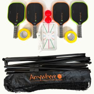 Flat-lay of the Anywhere Pickleball Activation Kit showing four black Nomado paddles with green and orange edge guards, two red pickleballs, yellow court tape, the Anywhere Protractor template, and a folded portable net with black Anywhere-branded carry b