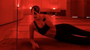 Person incorporating wellness technology into a personalized home recovery and self-care routine.