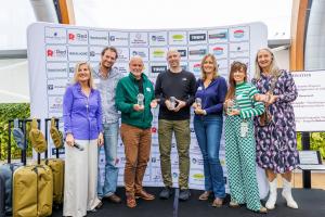 Photo shows the stage of the Dutch Travel Media Awards with the winnars of 2025