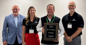 Chris Cantwell, Managing Director of Transworld Prospere's Las Vegas office, accepts the MVP Award at the July 2026 Transworld Business Advisors franchisee conference, marking the firm's tenth consecutive year as the top global team.