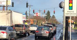 Cars stopped at a red light with Photo Enforced and NovoaGlobal Camera