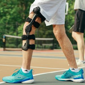 Person wearing an Icarus Ascender Unloader Knee Brace while playing pickleball.