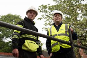 two men wearing DMR Training site uniforms overlooking a site