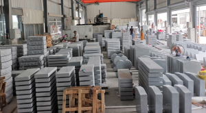 Granite monument components staged inside Boda Stone's production workshop.