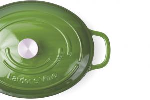 Close-up of the Okra 8-Quart Oval Dutch Oven lid in Larder & Vine's signature green finish with a stainless steel knob.