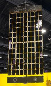 A complete Source Energy solar array wing built from 108 space-grade silicon modules, with black shingle-matrix cells set in a gold support frame.
