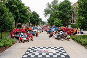 Teams gather around their vehicles at the Electrek American Solar Challenge Start Line