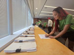 Cady Witt, the proposer of Initiative 86, turns in signatures at the Board of Elections.