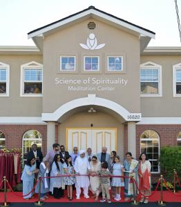 Sant Rajinder Singh Ji Maharaj cuts the ribbon at the Science of Spirituality Meditation Center inauguration in Lynnwood, Washington