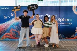 Four creators pose together at DHgate’s “From Good to GoodSphere” Co-Creation Workshop, with one holding a “Let’s co-create!” sign.