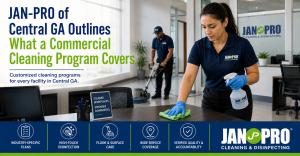 A JAN-PRO Cleaning & Disinfecting professional servicing an office workspace while another team member performs floor care, illustrating a recurring commercial cleaning program for Central Georgia facilities.