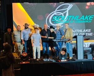 Priority Signs & Graphics team accepts the 2026 Southlake Small Business of the Year award during the Southlake Chamber of Commerce ceremony.