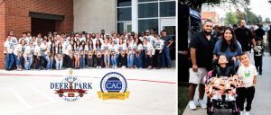 Large group of people in matching shirts posing outside a building; diverse family with children at an outdoor event on a sidewalk.