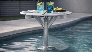 BajaMate luxury in-pool table system on a Baja shelf with drinks, designed for resort-style pool living and swim-up entertaining