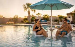 BajaMate luxury in-pool umbrella and table system on a Baja shelf with lounge chairs, designed for resort-style pool living and swim-up entertaining