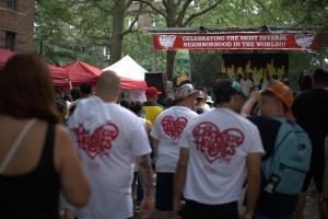 Attendees gather near the main stage during Jackson Heights Day, a community celebration in Jackson Heights, Queens.