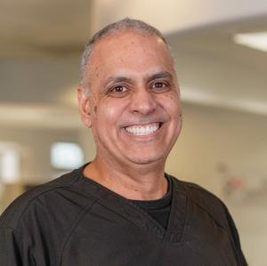 Dr. Navdeep Virk top-rated family dentist at Avenue Dental Care North Spokane offering comprehensive preventive and general dental care for all ages