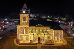 Historic courthouse with lights covering all sides