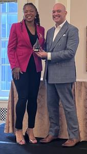 Monique Farmer, APR, poses with PRSA CEO, Matthew Marcial, CAE, CMP at the Women of Impact Awards celebration in Chicago.