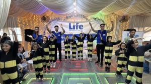 Photo of orphans at a community event organized by Life for Relief and Development (LIFE) sponsored orphans are dressed as bumble bees and are perfoming a short song.