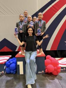 Coach Iryna Bielkina with her students Zhuban Azhar, Gasparyan Nicole, and Gu Avery after sweeping the podium at the American Championship in Miami.
