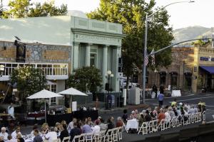 Guests seated at a long table outdoors
