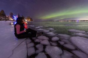 Sheri is photographing the aurora.