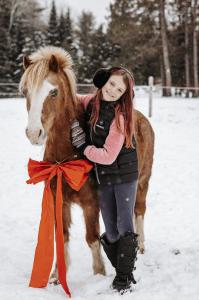 Frankie Riding a Horse in the Snow