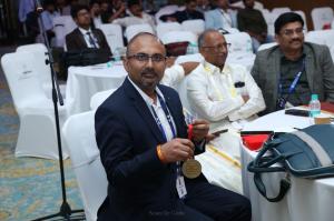 Dr. Rao holding and showing the COSSCON 2026 Best Paper Gold Medal to the press at the PASMISS–MISSABCON–COSSCON scientific meeting in Chennai.