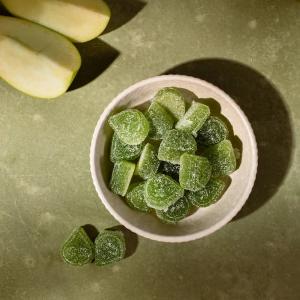 a bowl of green gummies