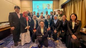 Group photo of the evening session attendees with both speakers