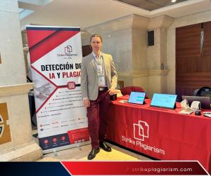 Michał Olszewski, Managing Director at StrikePlagiarism, standing at the StrikePlagiarism.com exhibition stand at LACCEI 2026.