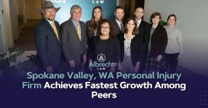 Albrecht Law PLLC team poses together with press release title, ‘Spokane Valley, WA Personal Injury Firm Achieves Fastest Growth Among Peers’.