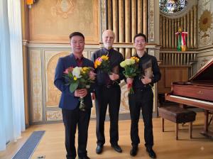 2026 competition winners (left to right) Ivan Wong (Second Prize), Phil Hosford (Third Prize) and Dr. Jim Chou (First Prize)