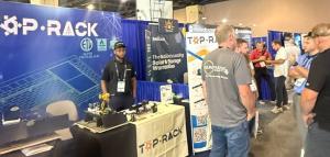 Attendees review TRT products and discuss project needs with the Top Rack team.