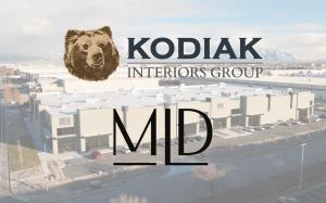 Kodiak Interiors Group and MLD logos in front of one of MLD's showrooms.