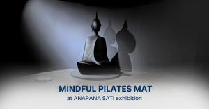 Immersive ANAPANA SATI exhibition installation featuring a seated meditation figure and dramatic shadows in a dark gallery space.
