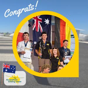Australian glider pilot Max Scutchings holds a trophy in front of the Australian flag, alongside teammates and fellow podium finishers at the 2026 Junior World Gliding Championships.