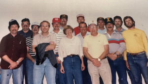 A group of 14 people, including one woman, stand together for a photo. This was the North Carolina MSF Instructor Prep class circa 1984. Ray Ochs is fourth from left and was the Chief Instructor of this class.