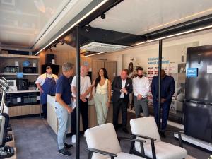 Interior of the Pulse Tranzformer expandable trailer fitted out as a Midea appliance showroom with kitchen display | The Clear Idea