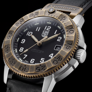 Close-up of the Luminox Adventure Watch 1300 Series with black dial, antique-bronze bezel, stainless steel case and black leather strap.