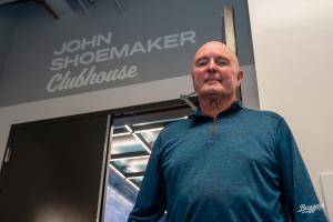 Photo of Ontario Tower Buzzers Manager John Shoemaker in front of clubhouse