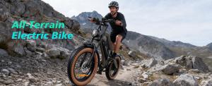 Rider on a DYU M20 all-terrain electric bike in a mountain landscape.