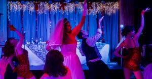 Bride and bridesmaids dancing at Tony n' Tina's Wedding at The Rio Hotel & Casino