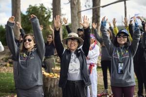 Volunteers with the Advancing Life Foundation smile and celebrate together as they work on a project.