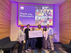McDonald's Owner/Operator Peter Ou presents a $10,000 ceremonial Golden Grant check to representatives from the New Conservatory Theatre Center for Education in San Francisco. The funding supports the organization's youth education and touring theatre pro