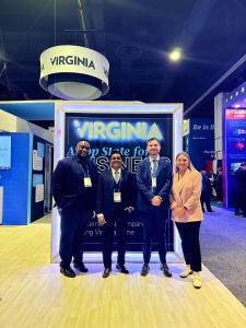 Anton Fonseka of CarePolicy.US standing with business representatives at the Virginia pavilion during the 2026 SelectUSA Investment Summit