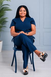 Blessing Dan-Dukor, APRN, PMHNP-BC, Psychiatric Mental Health Nurse Practitioner and founder of EMPATHRA Mental Health & Wellness Clinic LLC, seated in a professional setting.