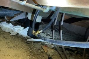 Close up of fragile gas line underneath dallas, tx home