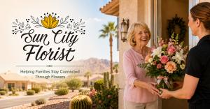 Sun City Florist delivery featuring a smiling senior woman receiving a pink, peach and white floral arrangement at her Sun City, Arizona home.